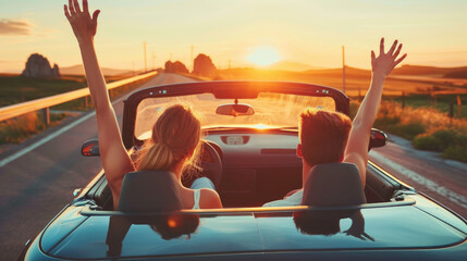 Happy couple driving convertible car on the road, Boyfriend and girlfriend with arms up having fun - Powered by Adobe