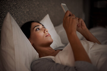 Woman, scroll and phone for social media, bed and relaxation under blankets in pajamas to sleep....