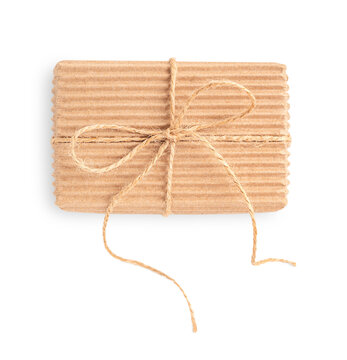 Top view of single simple craft eco friendly gift box made of sustainable recycled carton or paper tied with thread bow isolate on white background used as zero waste present for holiday celebration
