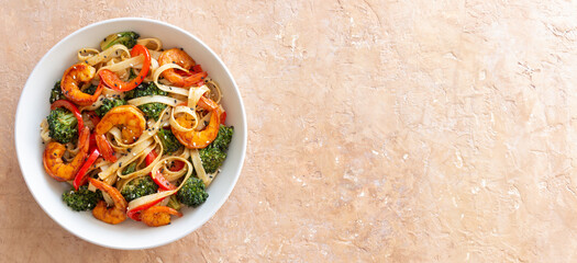 Udon noodles with shrimp, broccoli and peppers. Asian cuisine.