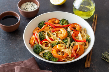 Udon noodles with shrimp, broccoli and peppers. Asian cuisine.