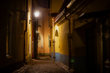 Empty night alley street in old town Tallinn Estonia