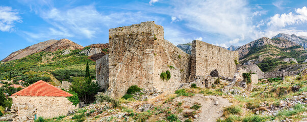 Town walls within ruins of Old Bar fortress, Montenegro - 752059997