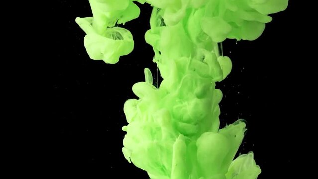 Abstract mixing of radium green ink in water.