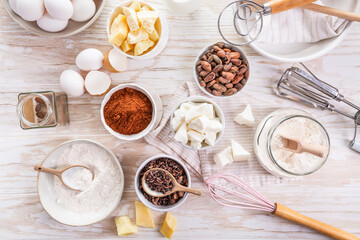 Organic cacao butter and baking ingredients with kitchen utensils