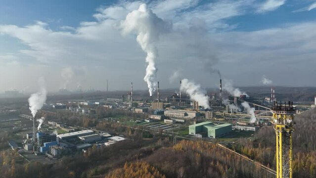 Aerial view of Coking Plant factory. Coke plant.Heavy industry in Europe, Poland, Dabrowa Gornicza. Air pollution from chimneys. Gas combustion in a coking plant.Ecology and environmental. 