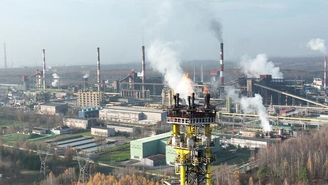 Aerial view of Coking Plant factory. Coke plant.Heavy industry in Europe, Poland, Dabrowa Gornicza. Air pollution from chimneys. Gas combustion in a coking plant.Ecology and environmental. 