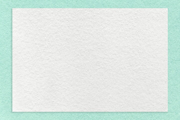 Texture of craft white color paper background with mint border, macro. Vintage dense kraft green...