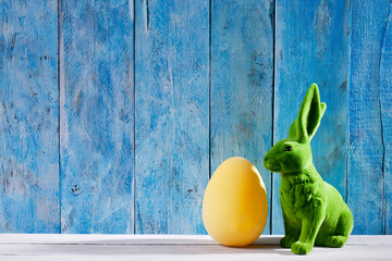 Easter decoration with green Easter bunny and a yellow Easter egg
