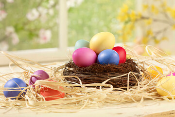 Color easter eggs in the nest