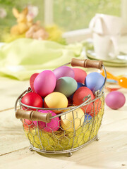 Color easter eggs in the basket