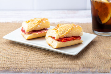 Irresistible mini sandwiches boasting savory sausage, perfect for any gathering or snack time delight.
