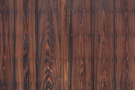 Wood texture background surface with old natural pattern, surface of old dark brown wood wall rustic weathered barn wood.
