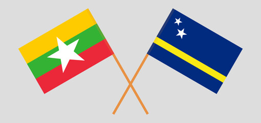 Crossed flags of Myanmar and Country of Curacao. Official colors. Correct proportion