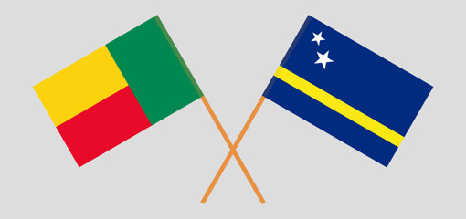 Crossed flags of Benin and Country of Curacao. Official colors. Correct proportion