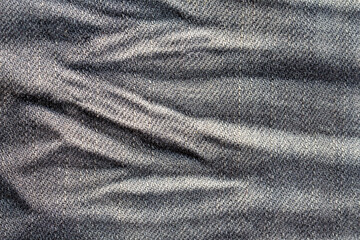 close up of wrinkle effect on jeans, denim wrinkle texture