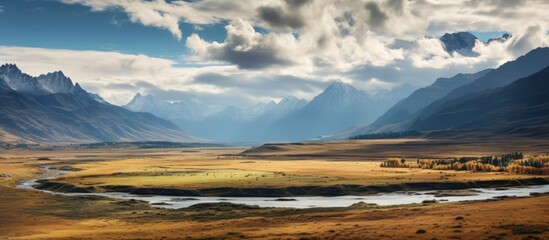 The Magnificent Altai Mountains: Majestic Autumn Landscape with Dramatic Clouds and Peaks