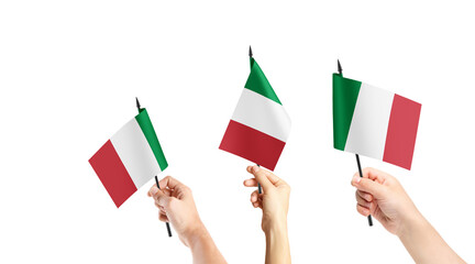 A group of people are holding small flags of Italy in their hands.