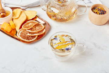 Aesthetic tea time, herbal tea table setting. Natural mountain organic tea - natural sustainable eco-friendly lifestyle. Soothing tea ceremony vibes.