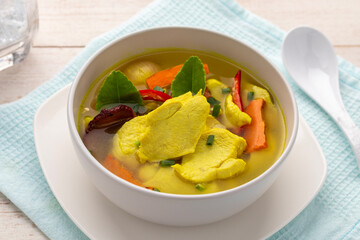 Turmeric chicken soup, hot and sour soup in southern Thai cuisine style. Turmeric makes the dish look yellowish and provides aroma. This tangy dish is easy to make, but delicious.