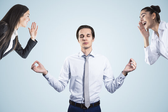 Young businessperson dealing with bullying at workplace on white background. Attractive european businessmen portrait.