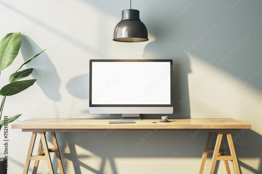 Poster Modern home office interior with empty white computer monitor on designer desktop. Decorative plant and concrete wall background with shadows. 3D Rendering.