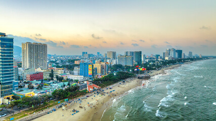 Vung Tau is a famous coastal city in the South of Vietnam. Vung Tau city aerial view in the sunset,...