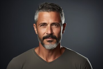 Portrait of handsome mature man with beard and mustache. Studio shot.