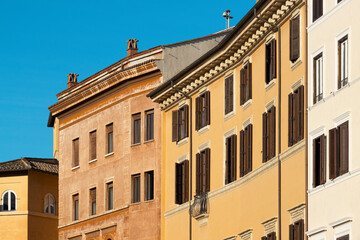 Traditional classic colored buildings facades in Rome city center. Italy