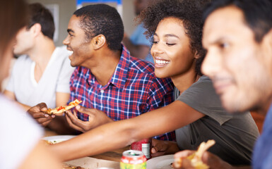 Friends, group and eating of pizza in house with happiness, soda and social gathering for bonding in dining room. Men, women and fast food with smile, drinks and diversity at table in lounge of home