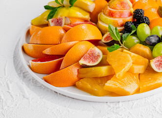 Exotic fruits platter isolated on white