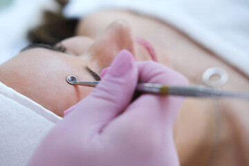 Close-up of a Facial Deep Cleansing Procedure. Close-up view of a cosmetologist performing a deep cleansing on a client's face using a specialized tool.