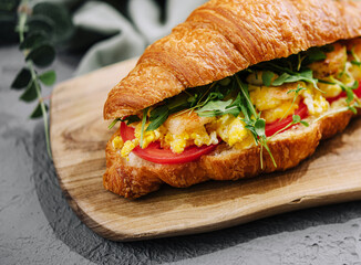 Croissant stuffed scrambled eggs with shrimps