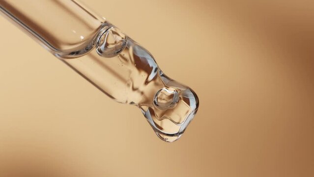 Several cosmetic droppers with face serum close-up with drops.