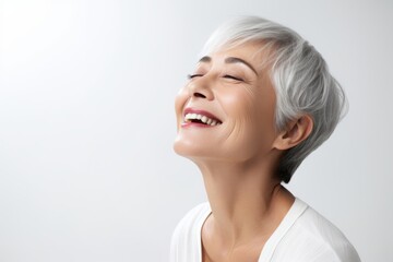 Beautiful smiling middle aged woman with closed eyes and closed eyes.