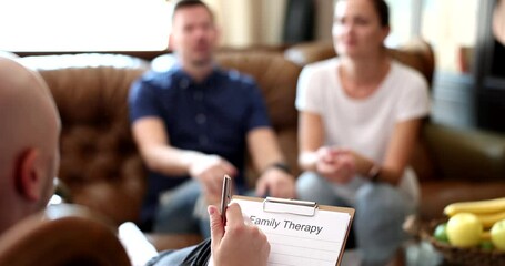 Woman with man on couch during psychotherapy session. Psychologist, consultant therapist psychiatrist or relationship counselor giving advice