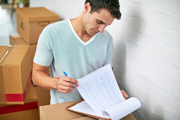 Man, boxes and home with clipboard for moving, delivery and documentation for logistics, check and...