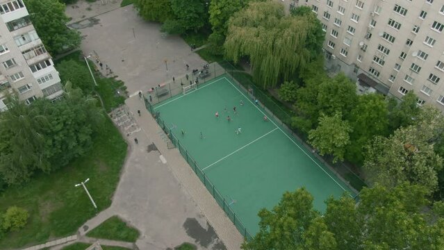Aerial View of Sports Arena for Floorball Competition with Multiple Goalposts. Drone View of Children Engaged in Sequence of Elimination Matches Based on Their School Grades