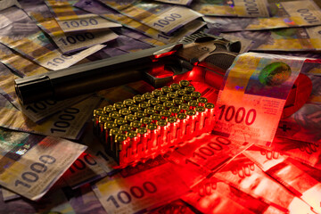Elegant Semiautomatic 9mm Handgun with Swiss Helvetia Symbol Leaning on Swiss Franc 1000 Banknote and Bullet Ammunition in Switzerland.