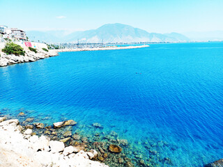 are you ready for summer? summer? clear blue sea, Magnificent aerial top view background photo of ocean sea water white wave splashing in deep sea. Drone photo background of sea wave in bird's eye wav