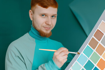 Young Male Designer Choosing Colors from Swatch Palette