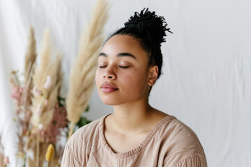 Serene Young Woman with Closed Eyes Enjoying Peaceful Moment
