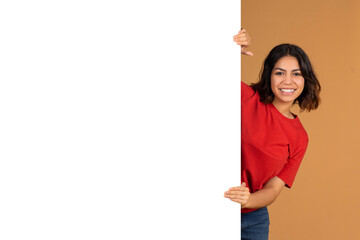 Arab Lady Standing By Copy Space On White Advertisement Board