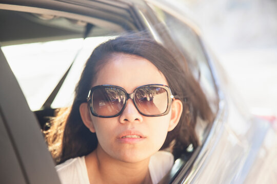 Woman Looking out of Car Window
