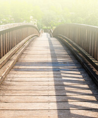 Old wooden bridge on soft sunlight