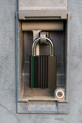 Heavy industrial padlock in framed lockbox - safety concept.