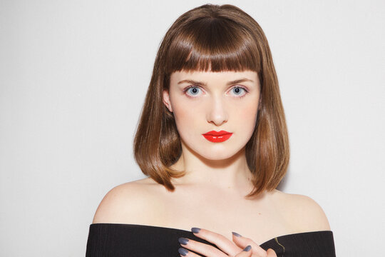 Close up of Young Woman with Red Lips and Bobbed Hair
