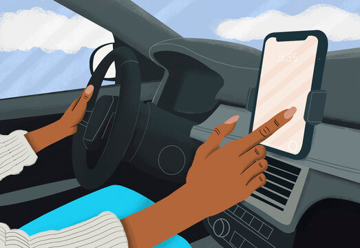 Close up woman driving and using touch screen smart phone in car
