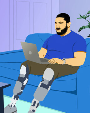 Man with prosthetic legs working from home at laptop on living room sofa
