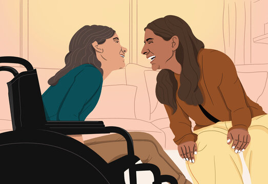 Happy woman in wheelchair laughing with friend

